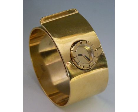 A ladies' cuff-style gold-plated Lanvin mechanical bangle watch,
with a circular gold dial and black hands, a raised flat sec