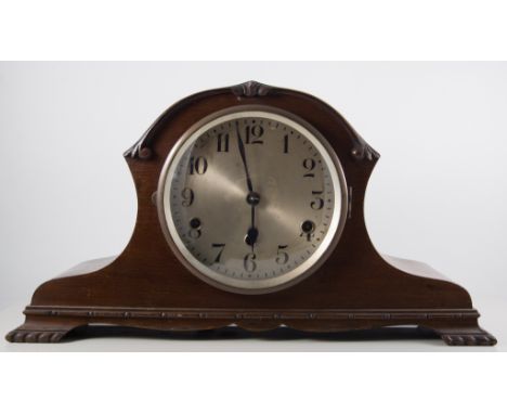A mahogany cased eight-day mantle clock.