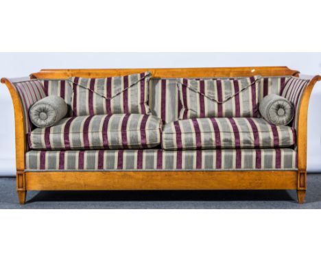 Regency style wooden framed sofa, striped upholstery and cushion pads.