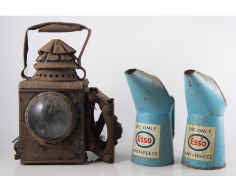 Three Esso branded oil and antifreeze cans, railway lamps, vintage bike light etc.