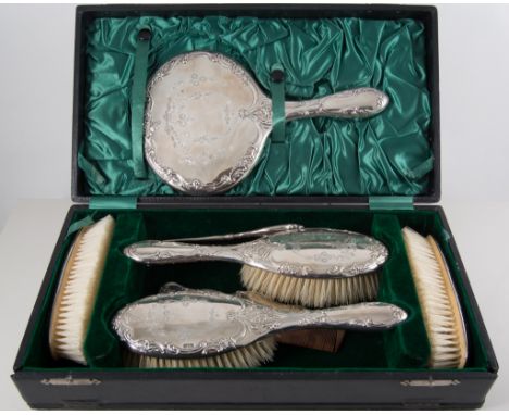 Silver backed dressing table set, two hair brushes, two clothes brushes, a hand mirror, comb, button hook and shoe horn, repo