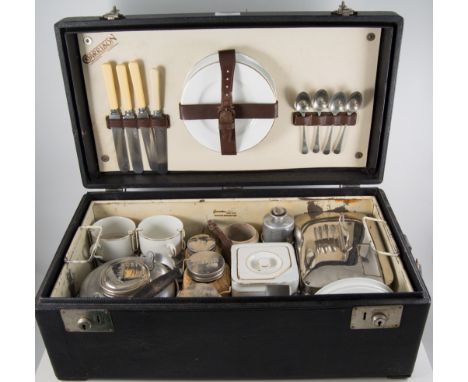 Picnic set, by Garrisen, hard bodied case, containing ceramic tea set, cane covered storage jars etc, with lift out interior.