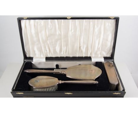 Silver backed dressing table set, hair brush, clothes brush, a hand mirror and comb, engine turned design, hallmarked Birming