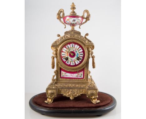 Late 19th century French gilt metal mantel clock, porcelain panels, enamelled with flowers, worn, repaired, circular dial wit