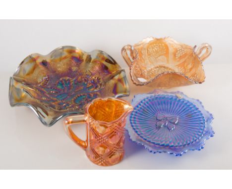 Carnival glass bowl, circular form with a wavy rim, moulded with a rural scene, tripod legs, 22cm; a collection of similar Ca