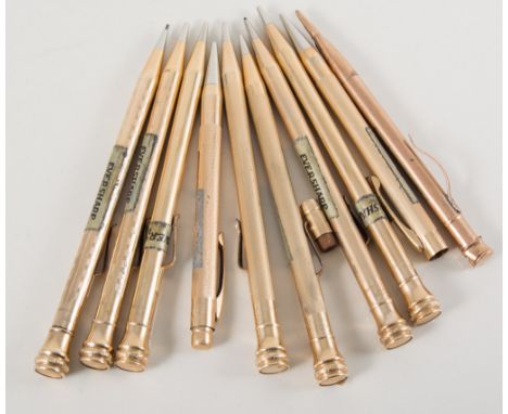 Seven gold filled Eversharp pencils, having circular barrels, various engine turned designs, all 13.5cm long, not boxed.Footn