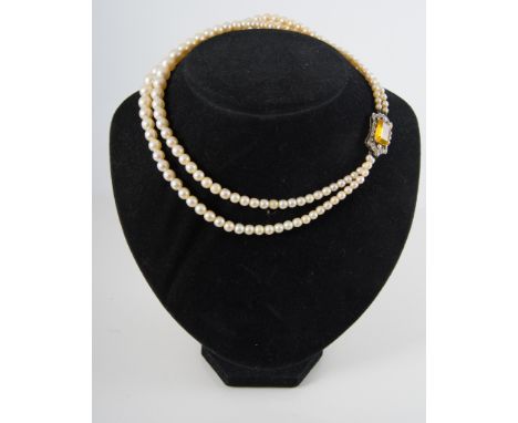 A two row cultured pearl necklace with diamond snap, cultured pearls (67) and (71), graduating in size from 3.8mm to 9mm, fit