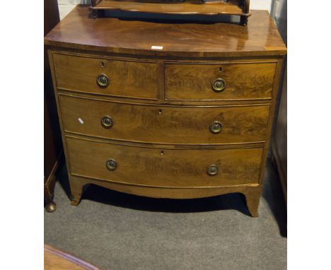 Small Victorian bow front chest of drawers, fitted with two short and two long graduating drawers, shaped apron on splayed br