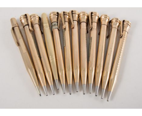 Twelve gold filled Eversharp pencils, having circular and hexagonal barrels, various engine turned designs, all 10cm long, no