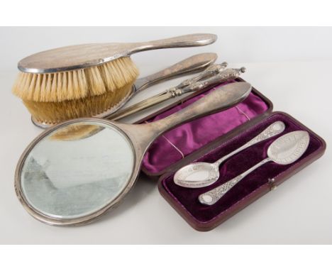 Silver backed dressing table set, comprising a hand mirror, two hair brushes and a clothes brush, engine turned design, Birmi