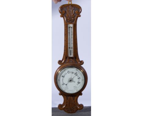 Victorian oak barometer, carved frame with attached thermometer, 8" dial, length 56cm.