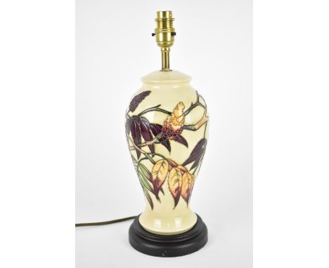 A Moorcroft Pottery Sumac Tree pattern table lamp base designed by Phillip Gibson, the body decorated with tubelined autumnal