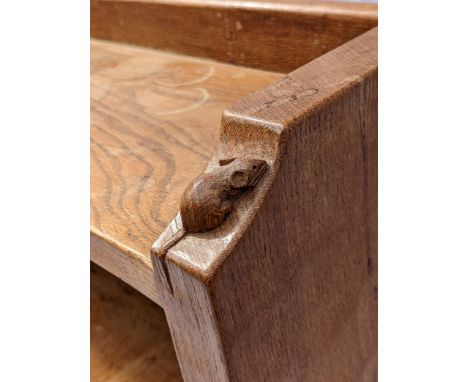 Robert 'Mouseman' Thompson of Kilburn (1876-1955), an oak bookcase, holding three shelves, the gallery top with carved mouse,
