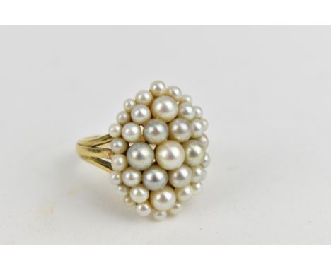 An 18ct yellow gold ring set with numerous graduating pearls, (one deficient), stamped PG LD, size Q/R, 8.5g 