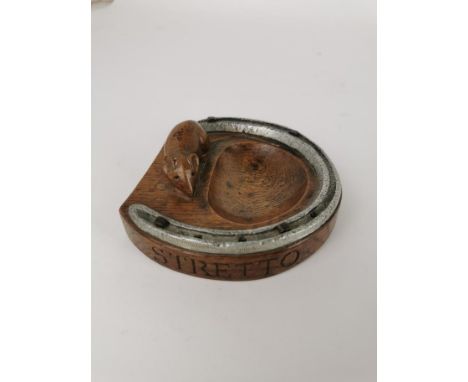 Robert 'Mouseman' Thompson of Kilburn (1876-1955), a carved oak and steel horseshoe pin tray, with signature carved mouse, ca