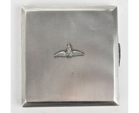 A George VI silver and enamel cigarette case by H C Freeman Ltd, London 1937, of square shape with engine turned exterior wit