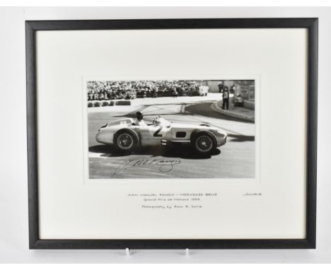 A signed reprinted photograph of Juan Manuel Fangio, racing a Mercedes Benz, Grand Prix de Monaco 1955, photographed by Alan 