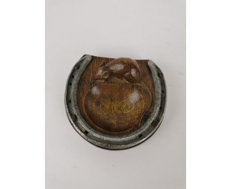 Robert 'Mouseman' Thompson of Kilburn (1876-1955), a carved oak and steel horseshoe pin tray, with signature carved mouse, ca