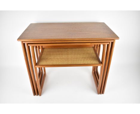 Johannes Andersen for Silkeborg Denmark, circa 1970s, a nest of three rectangular teak tables, the smaller one with woven rat