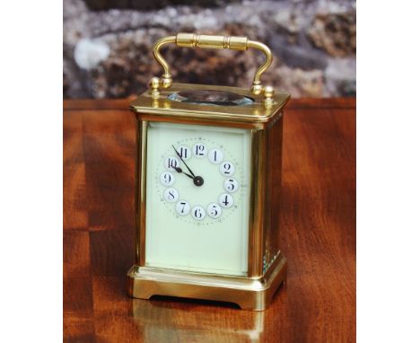 A French single train, brass cased carriage clock, early 20th century, the very pale green enamel dial with Arabic numerals s