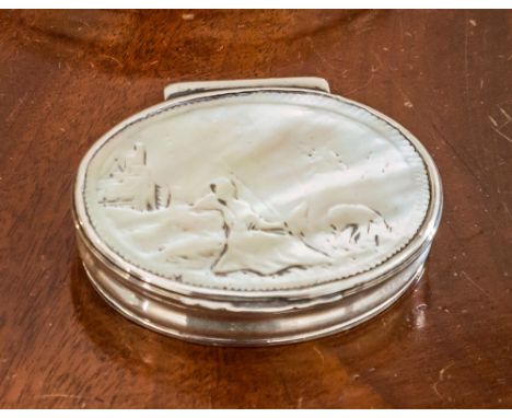 An English oval silver snuff box, unmarked, c.1800, the top with carved mother of pearl pastoral scene, 2½in. (6.5cm.) long.