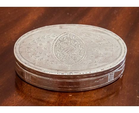 A French oval snuff box, c.1810, the top engraved with trophies, the sides with bright cut swags within crosshatched uprights