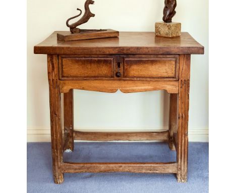 A small 18th century Continental walnut single drawer side table, the rectangular top over the two panel drawer and shaped fr