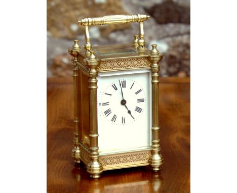 An unusual French gilt brass pillar case carriage clock, early 20th century, by Duverdrey & Bloquel, the white enamel Roman d