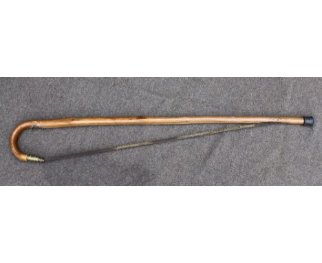 A Victorian saw stick novelty walking cane, with crook handle and spring loaded brass mount for locking blade, 38¼in. (97.25c