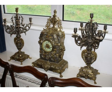 A large French baroque style mantel clock garniture by A. D. Mougin of Paris, early 20th century, the outside countwheel, bel