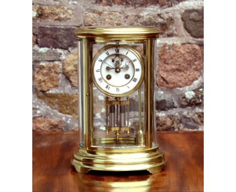 A French oval gilt brass cased, four glass mantel clock, c.1900, the S. Marti & Cie two train movement, no. 106275.7, with vi