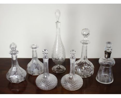 Seven assorted 19th century & later decanters, one thistle shaped with silver collar, Birmingham 1908; one slender tear drop 