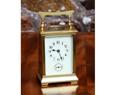 A gilt brass Anglaise cased carriage clock with alarm, early 20th century, the white enamel face with Arabic numerals and ala
