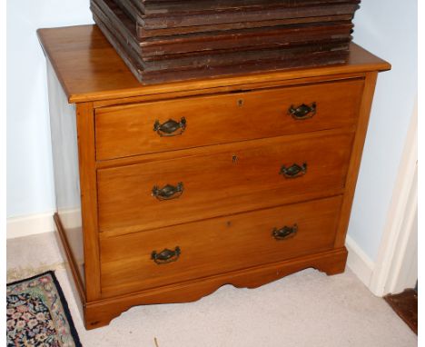 A Continental satin walnut three drawer chest, c.1930, on a shaped skirt and bracket feet, 36 x 20¾in. (91.5 x 52.75cm.), 30¼