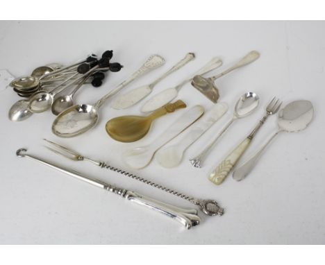 A small quantity of silver smalls, comprising a silver handled button-hook, silver pickle fork, silver teaspoons, two butter 