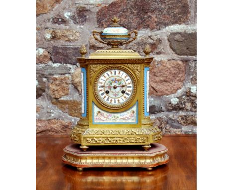 A French late 19th century gilt brass cased mantel clock with Sevres style porcelain panels, the movement signed JBD (Jean Ba