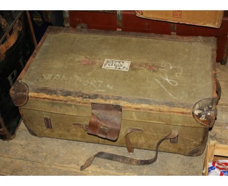 A green linen and leather trunk, c.1920, with a lift out tray, 33½ x 20 x 12in. (85 x 50.75 x 30.5cm.) high.