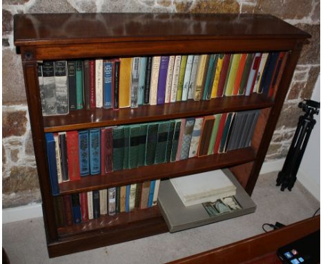 A set of late 19th century straight grain walnut open book shelves, the caddy moulded top over two adjustable shelves within 