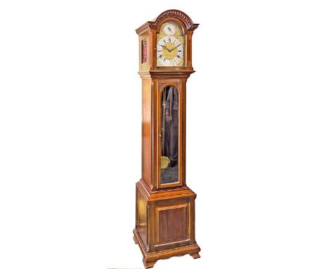 A good quality mahogany cased musical grandmother clock, c.1900, the egg & dart moulded arched cornice over an arched brass d