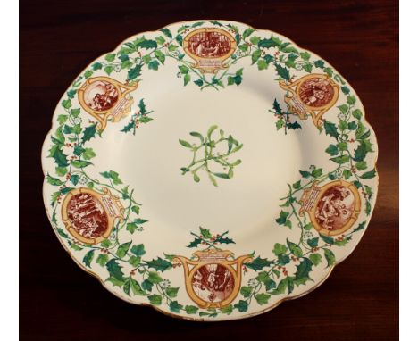 A large Edwardian Royal Worcester Vitreous Christmas plate, the centre with a sprig of mistletoe and the shaped edge with six
