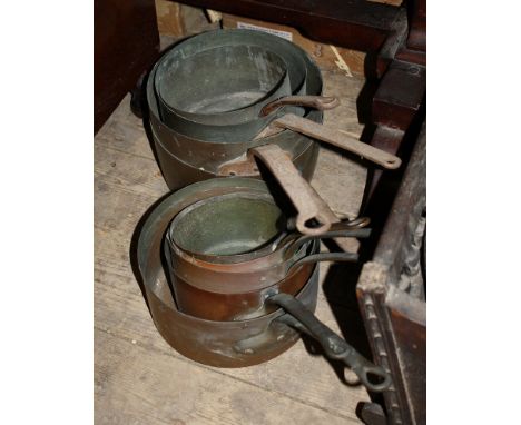 Two graduated sets of four vintage copper pans (8), 