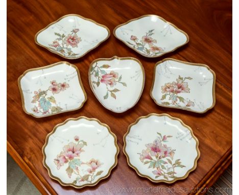 A late 19th century Wedgwood part dessert service, well painted with flowers and gilding in the Aesthetic manner, comprising 