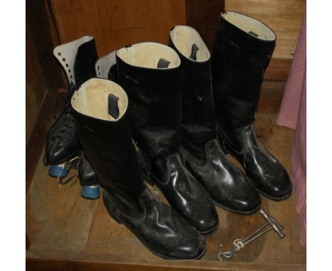 Two pairs of black leather riding boots, together with a pair of black leather roller skates. (3)