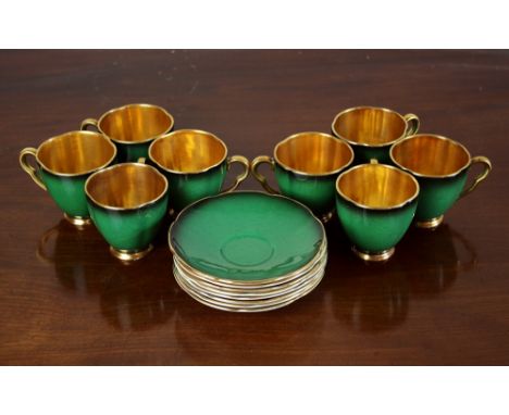 A set of eight Carltonware Verte Royale coffee cups and saucers, handpainted green with gilded interiors, the saucers 4½in. (