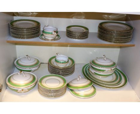 A Shelley part dinner service, 1930s, green and gilt decorated, including three graduated oval platters, three tureens, two s