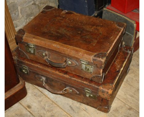 Two vintage brown leather suit cases, the larger by Joseph Last of Haymarket, London, 30 x 18½in., the other by R. W. Forsyth