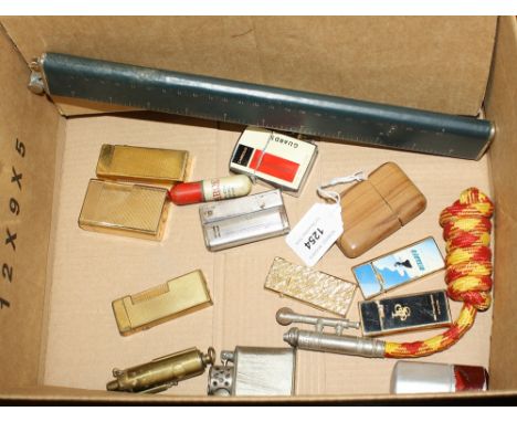 A Dunhill gold plated cigarette lighter, with engine turned decoration; together with another (worn); and thirteen others. (1