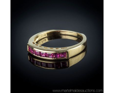 An 18ct gold and ruby ring, channel set with seven square cut rubies of good colour, ring size M.