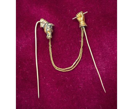 Two French gold stick pins, early 20th century, one modelled as a horse's head with black enamelled bridle, the other as a ga