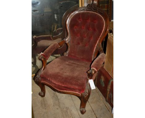 A mid Victorian walnut framed button back open arm chair, for restoration, 